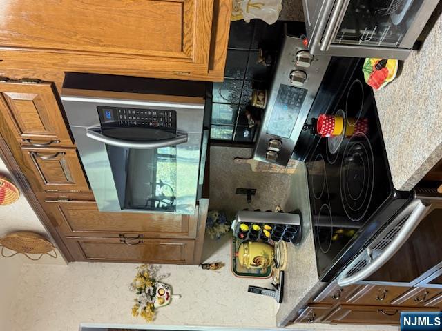140 Euclid Avenue, Unit 4G Hackensack, NJ 07601 - Photo 7 of 13 a kitchen with stainless steel appliances granite countertop a stove and a microwave