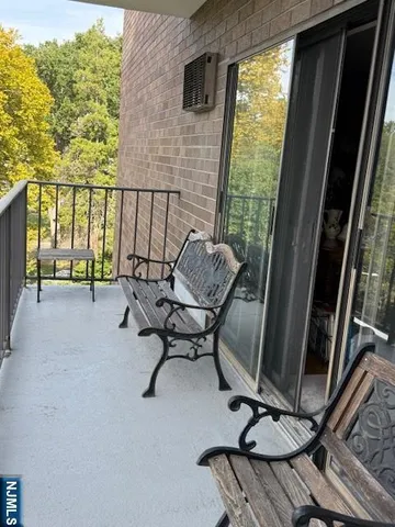 a view of a chairs and table in patio with a backyard