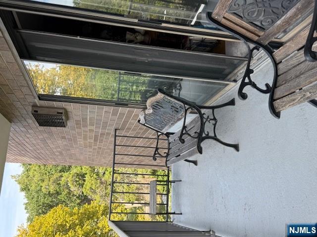 140 Euclid Avenue, Unit 4G Hackensack, NJ 07601 - Photo 9 of 13 a view of a chairs and table in patio with a backyard