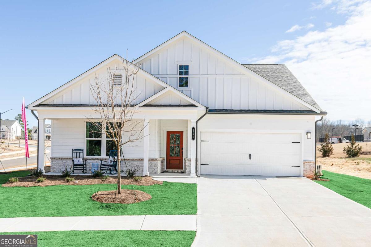 740 Coventry Cv Way Acworth, GA 30102 - Photo 22 of 41 a view of a house with a garden and pathway