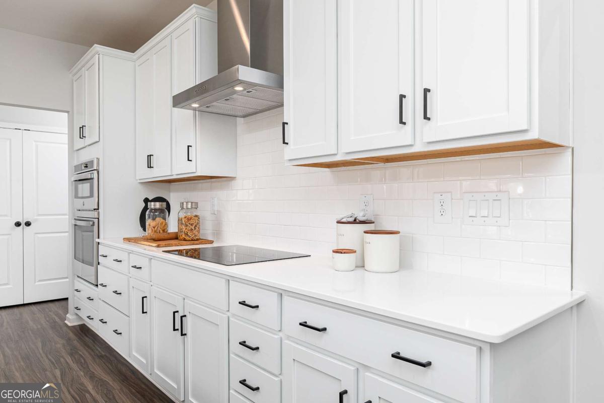 740 Coventry Cv Way Acworth, GA 30102 - Photo 26 of 41 a kitchen with white cabinets and sink