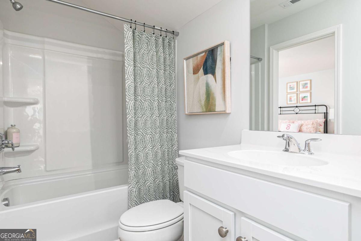 740 Coventry Cv Way Acworth, GA 30102 - Photo 3 of 41 a bathroom with a sink a toilet and shower