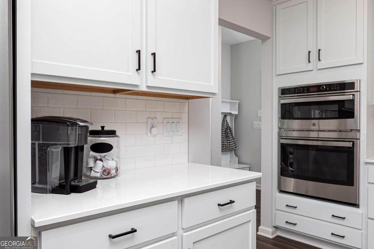 740 Coventry Cv Way Acworth, GA 30102 - Photo 31 of 41 a kitchen with a stove and a microwave
