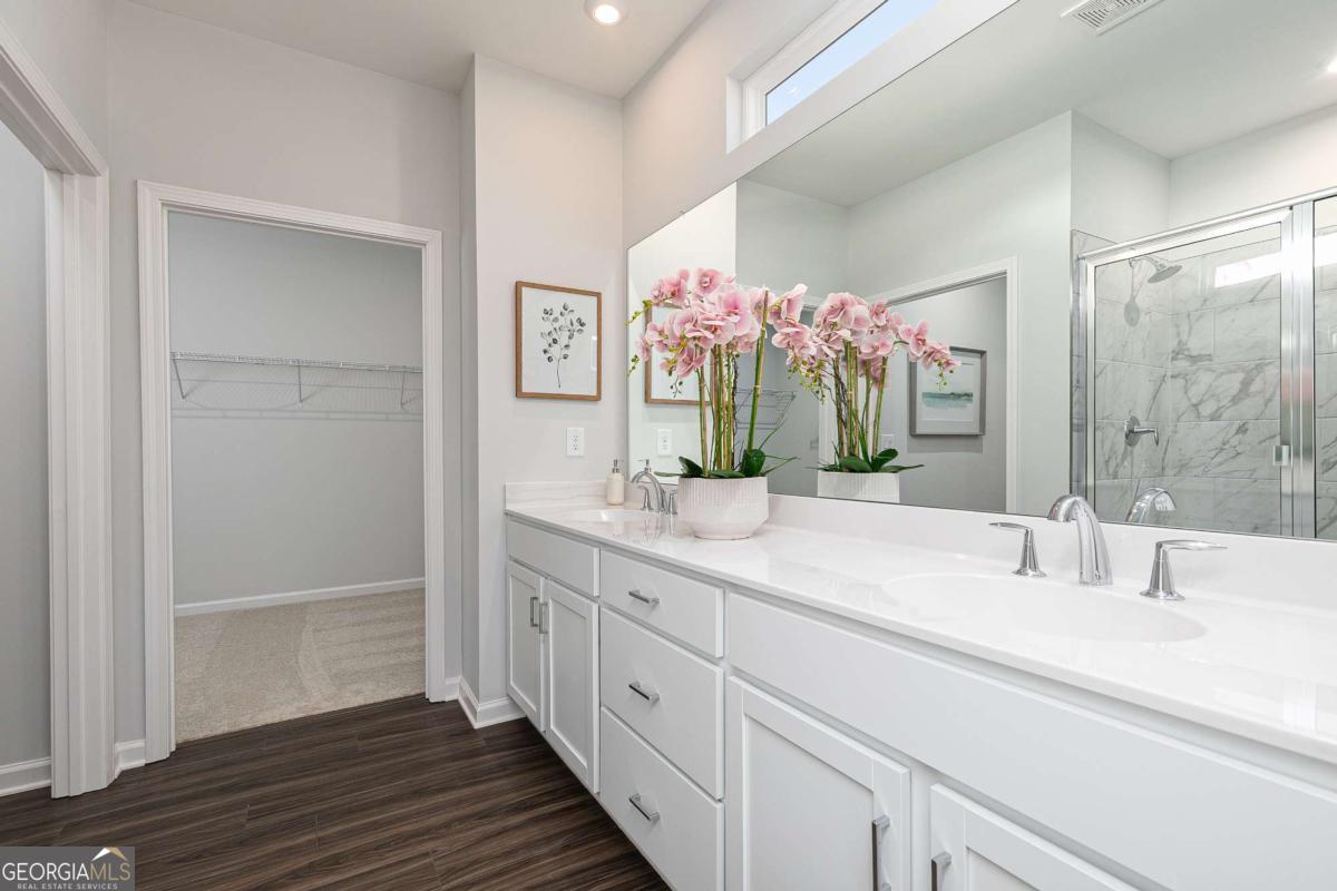 740 Coventry Cv Way Acworth, GA 30102 - Photo 37 of 41 a spacious bathroom with a sink double vanity granite and a mirror