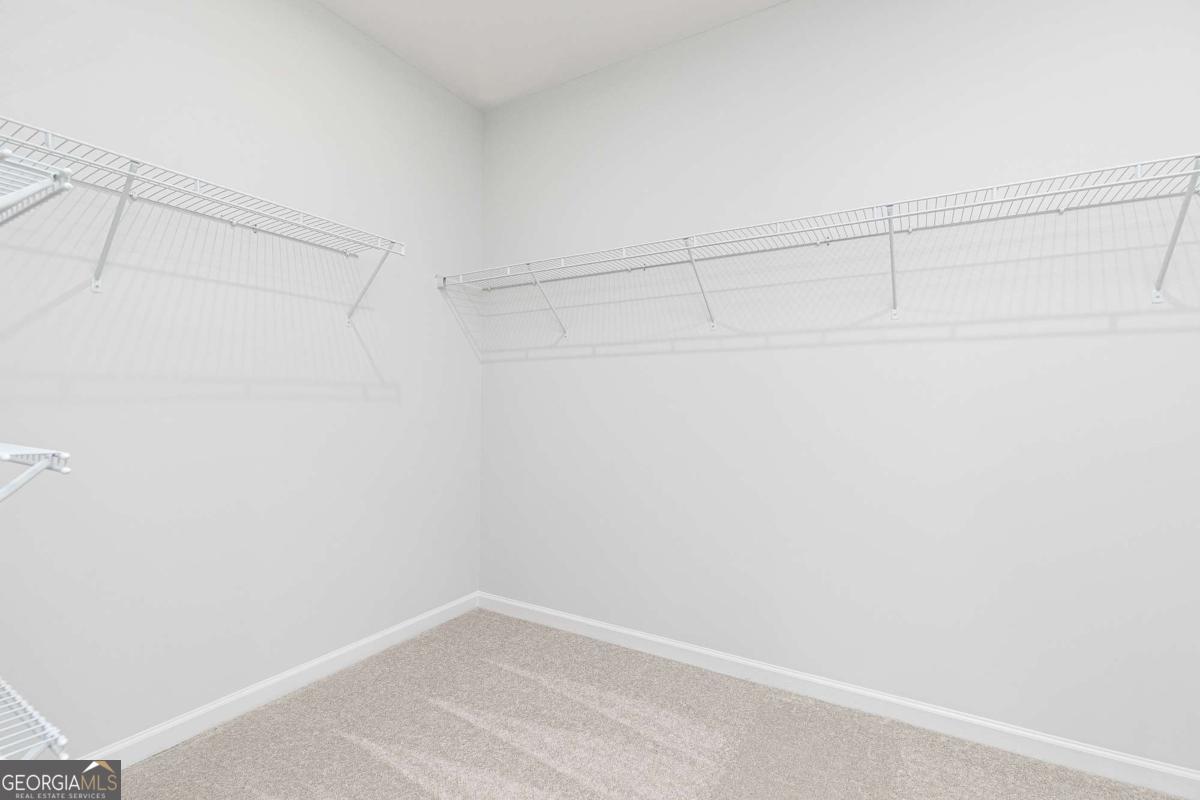 740 Coventry Cv Way Acworth, GA 30102 - Photo 41 of 41 a view of a room with racks on the wall