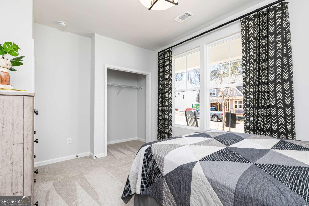 740 Coventry Cv Way Acworth, GA 30102 - Photo 5 of 41 a bedroom with a bed and a window