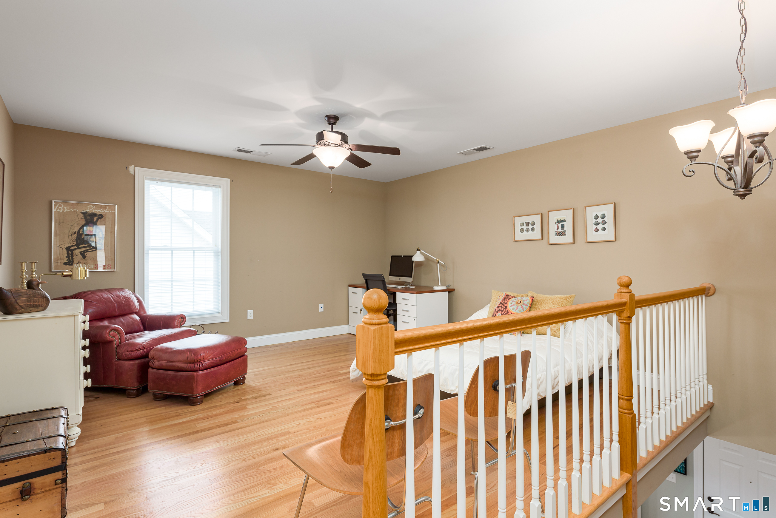 8 Greendale Drive, Unit 8 Suffield, CT 06078 - Photo 30 of 40 a view of a livingroom with furniture and hardwood floor