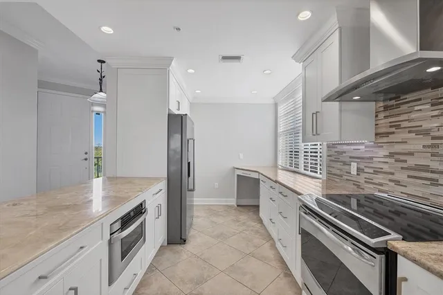 a bathroom with a granite countertop sink toilet mirror and shower