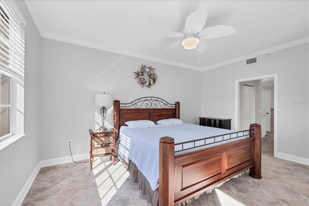 13313 Gasparilla Road, Unit C401 Placida, FL 33946 - Photo 14 of 30 a bed room with a bed and a window