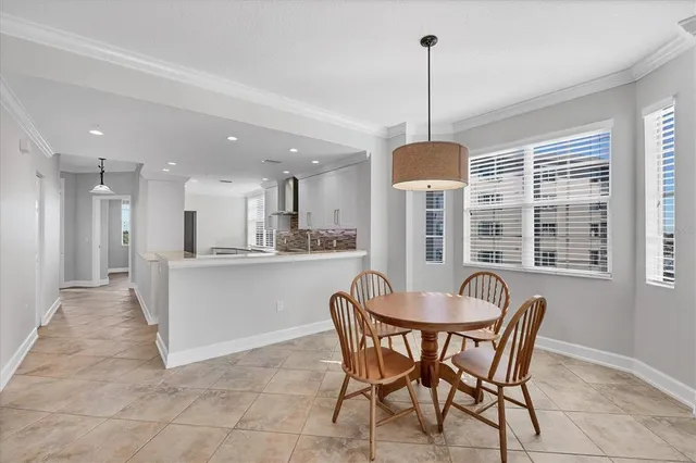 a bedroom with a bed and a table with lamp