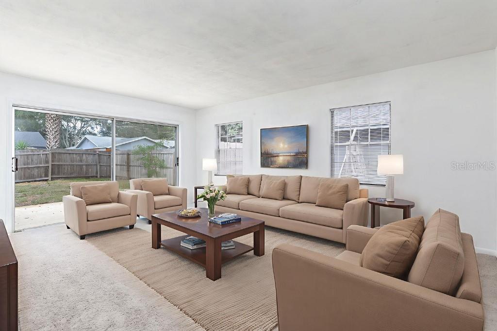 2453 Worthington Road Maitland, FL 32751 - Photo 12 of 22 a living room with furniture and a large window