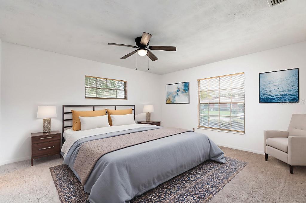 2453 Worthington Road Maitland, FL 32751 - Photo 15 of 22 a bedroom with a large bed and a window