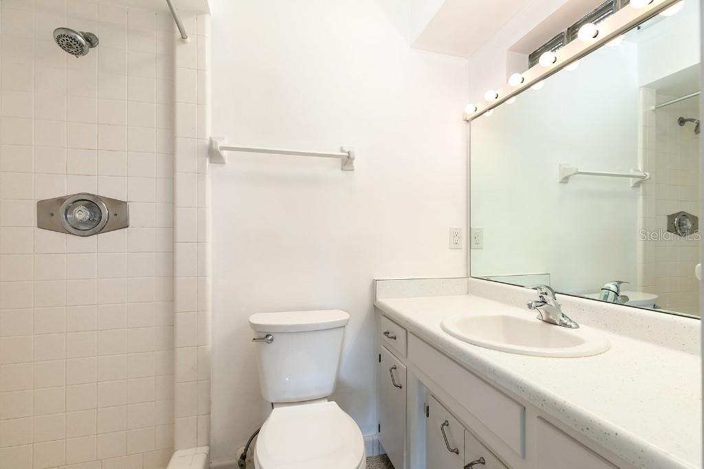 2453 Worthington Road Maitland, FL 32751 - Photo 16 of 22 a bathroom with a sink toilet and shower