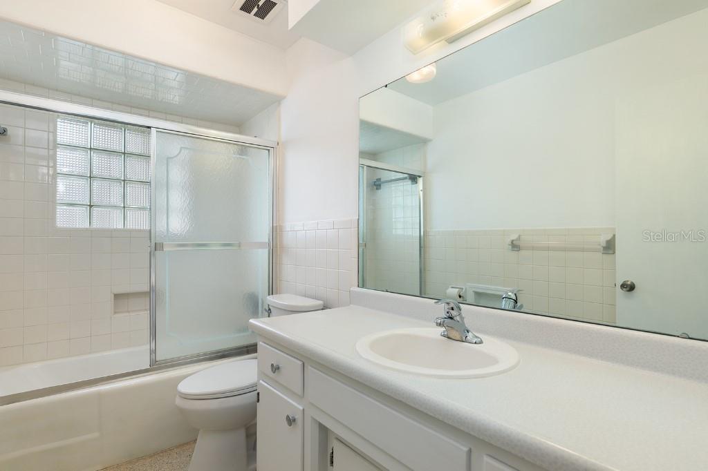 2453 Worthington Road Maitland, FL 32751 - Photo 18 of 22 a bathroom with a sink toilet and shower