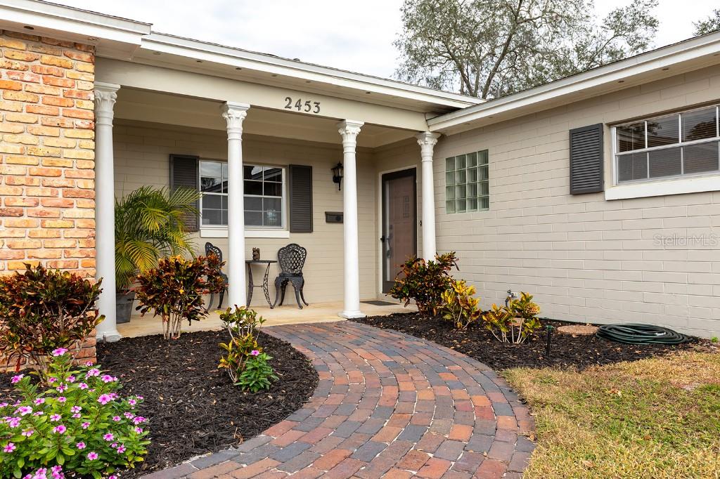 2453 Worthington Road Maitland, FL 32751 - Photo 2 of 22 a front view of a house with a patio