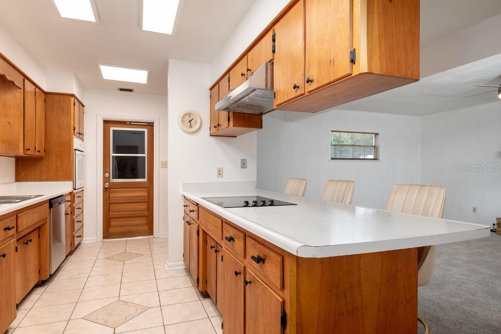 2453 Worthington Road Maitland, FL 32751 - Photo 5 of 22 a kitchen with stainless steel appliances granite countertop a sink and a stove