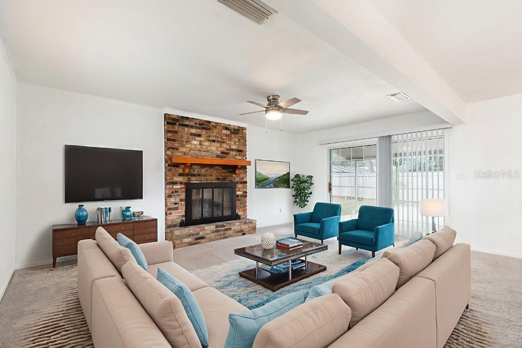 2453 Worthington Road Maitland, FL 32751 - Photo 9 of 22 a living room with furniture and a flat screen tv