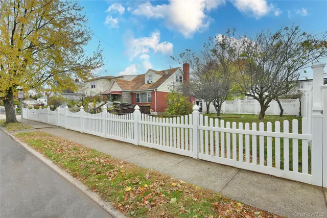 a view of a balcony with wooden fence