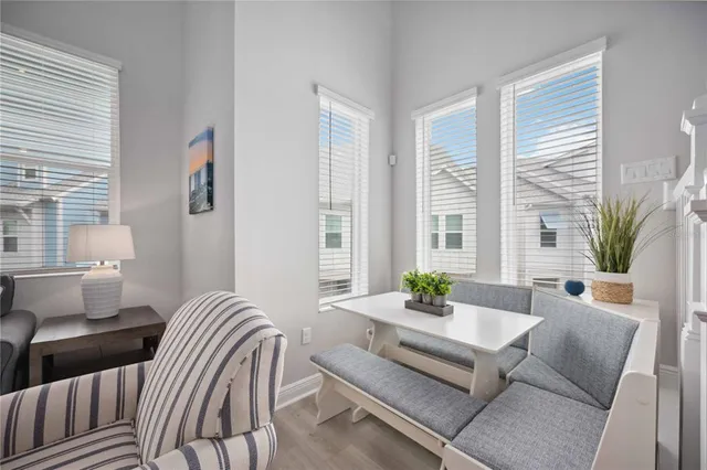a living room with furniture and windows