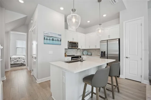 a kitchen with a table and chairs in it