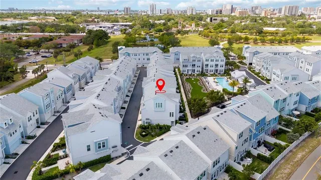 an aerial view of residential houses with outdoor space