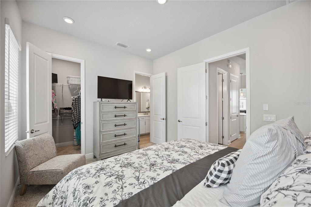 2344 Lindstrom Street Sarasota, FL 34237 - Photo 32 of 56 a bedroom with a bed and a couch