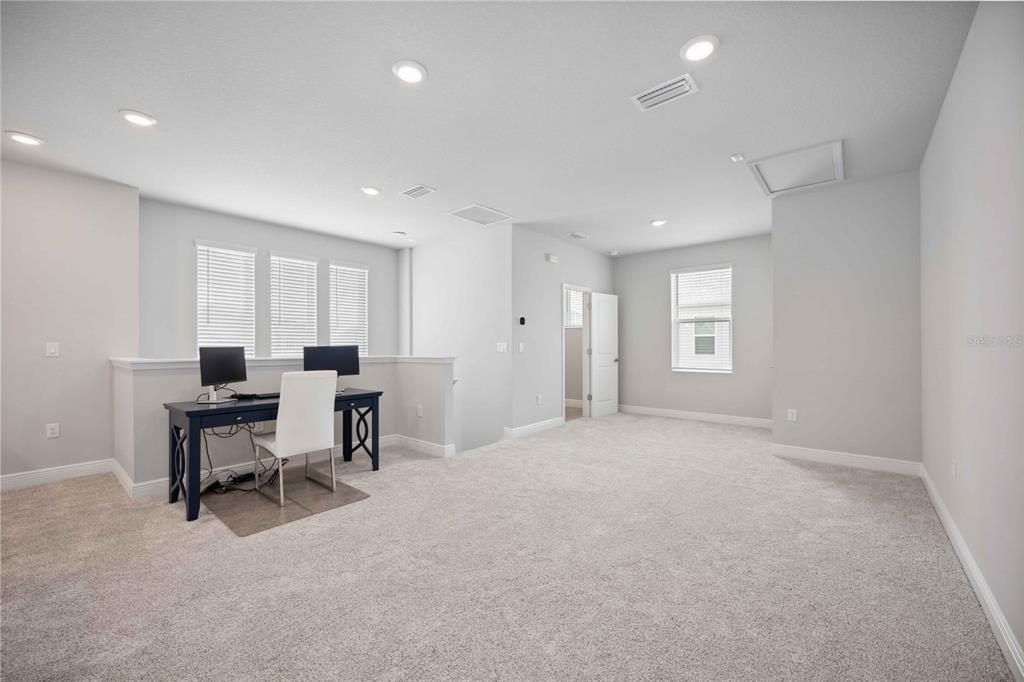 2344 Lindstrom Street Sarasota, FL 34237 - Photo 36 of 56 a view of a workspace with furniture and a window