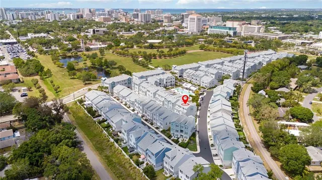 an aerial view of residential houses with outdoor space