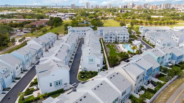 an aerial view of residential houses with outdoor space
