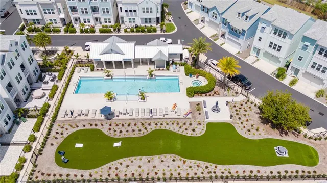 an aerial view of residential houses with outdoor space