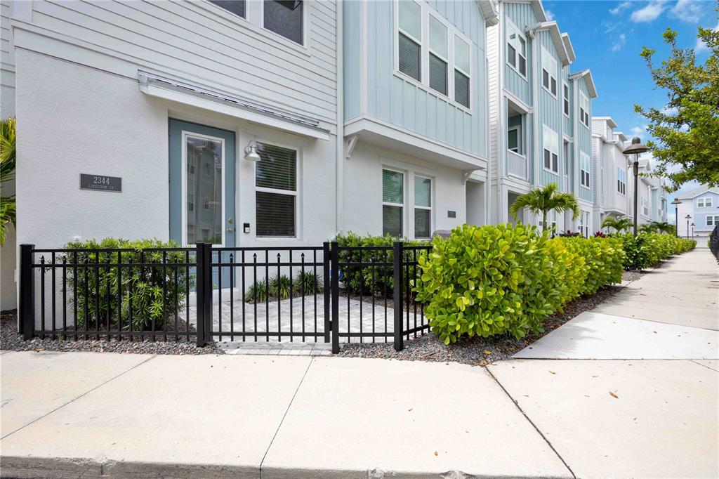 2344 Lindstrom Street Sarasota, FL 34237 - Photo 7 of 56 a view of a building with a garden