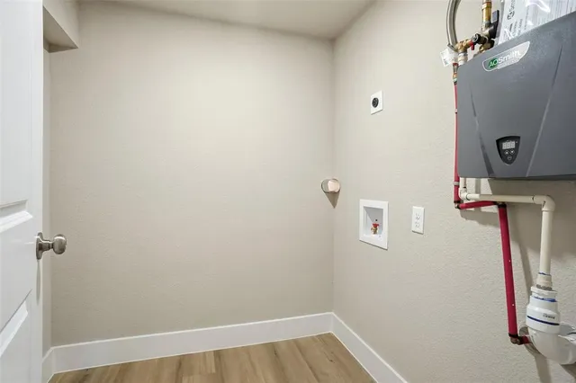 a view of door with wooden floor