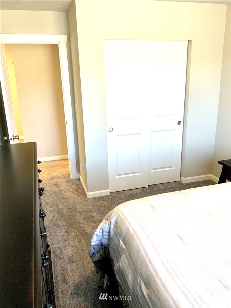 5107 Kenrick Street Southeast Lacey, WA 98503 - Photo 25 of 31 a bedroom with a bed and a mirror