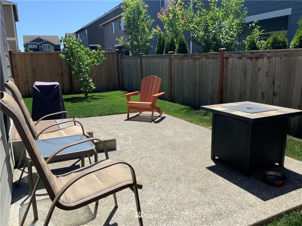 5107 Kenrick Street Southeast Lacey, WA 98503 - Photo 26 of 31 a view of a backyard with furniture and outdoor seating