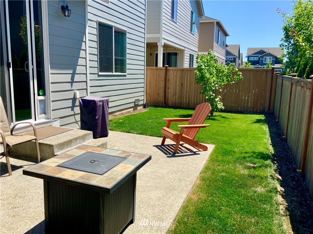 5107 Kenrick Street Southeast Lacey, WA 98503 - Photo 28 of 31 a view of a backyard with sitting area