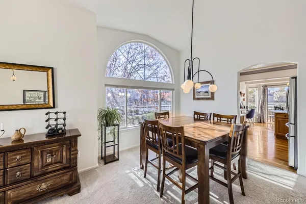 a kitchen that has a lot of cabinets a sink and appliances in it