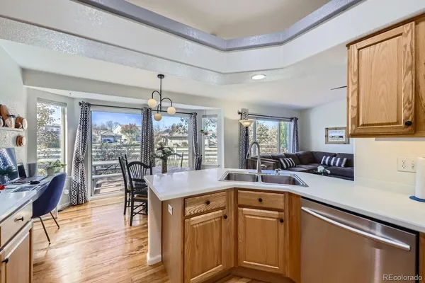 a kitchen with stainless steel appliances a stove sink microwave and cabinets