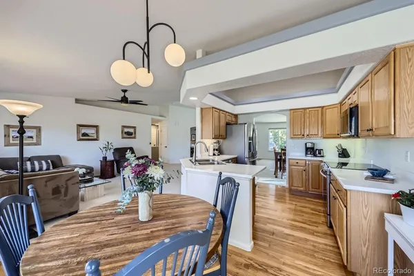 a view of a dining room with furniture window and wooden floor