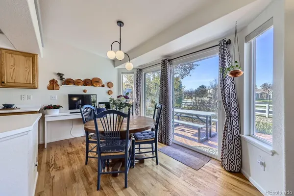 a livingroom with workspace and a window