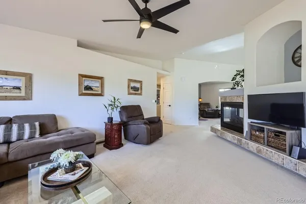 a view of a livingroom with workspace and a couch