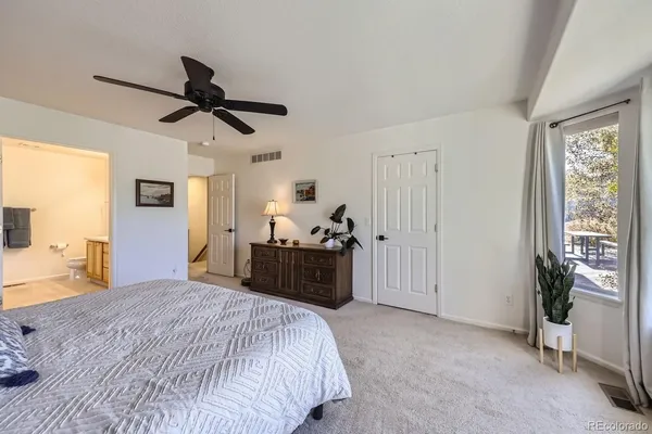 a bathroom with a double vanity sink mirror and toilet