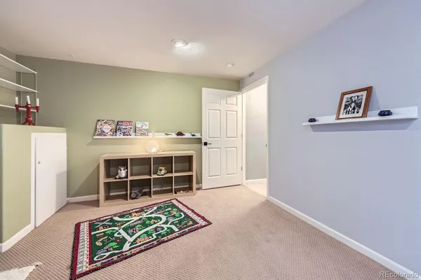a view of a livingroom with furniture and a window