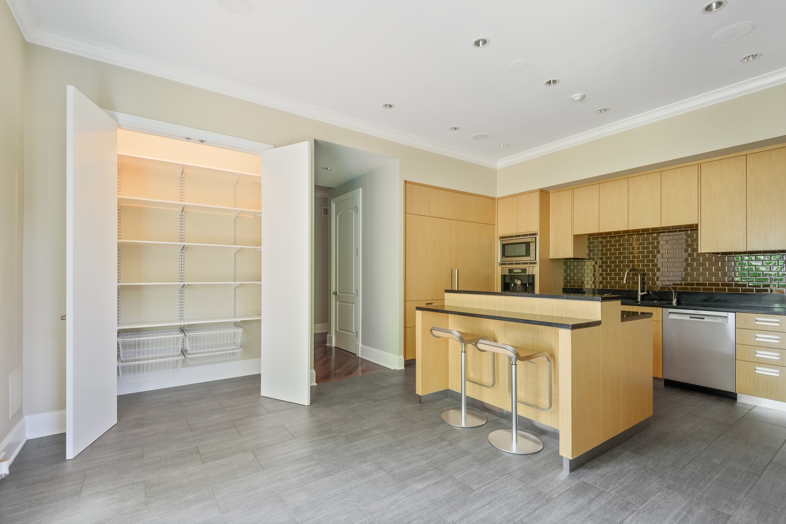 2015 Lake Avenue Wilmette, IL 60091 - Photo 12 of 45 a kitchen with stainless steel appliances a white stove top oven and white cabinets