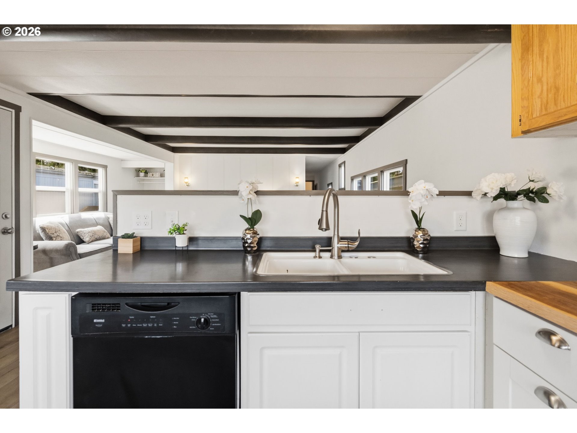 205 South 54th Street, Unit 76 Springfield, OR 97478 - Photo 7 of 41 a kitchen with a sink and a refrigerator