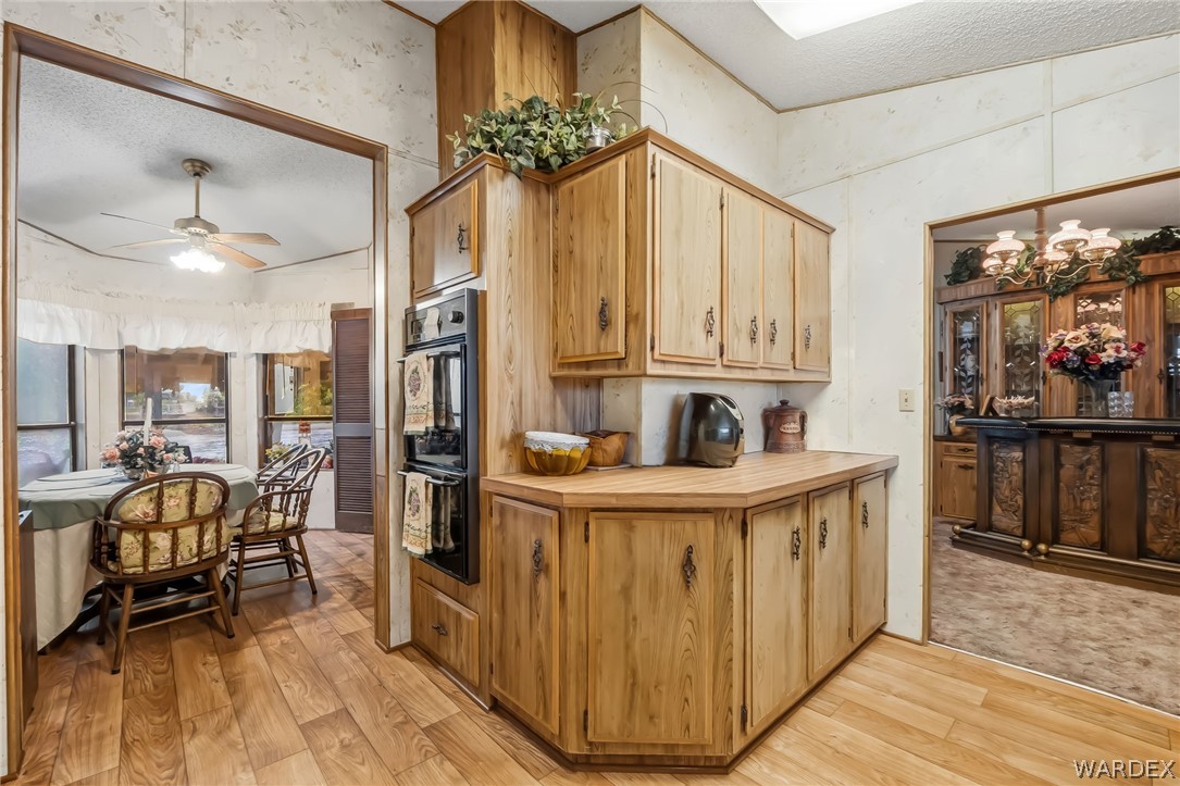10031 Dike Road Mohave Valley, AZ 86440 - Photo 53 of 78 a view of a kitchen filled with furniture and a kitchen