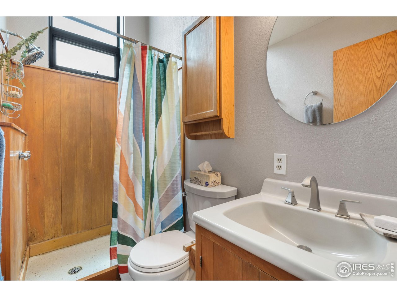 89 Gold Trail Boulder, CO 80302 - Photo 23 of 48 a bathroom with a sink a mirror and a shower
