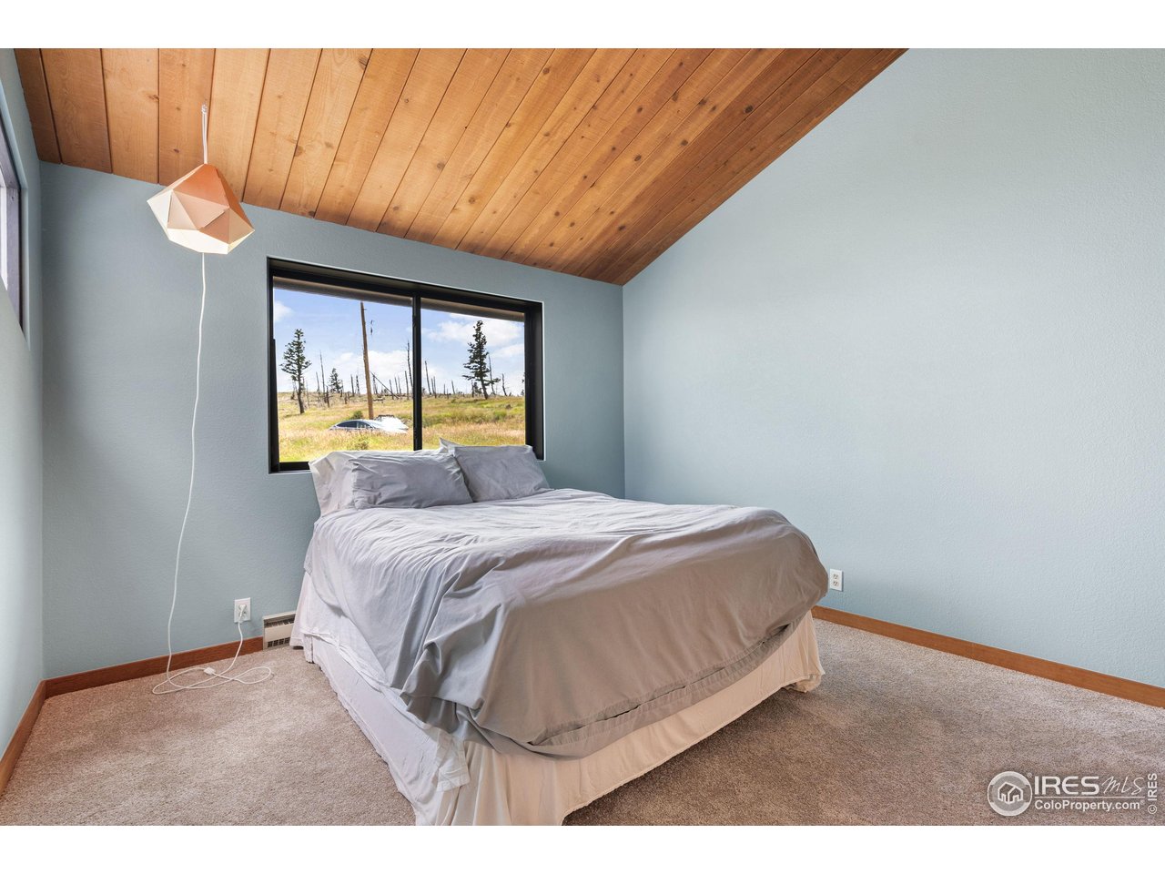 89 Gold Trail Boulder, CO 80302 - Photo 25 of 48 a bedroom with a bed and a window