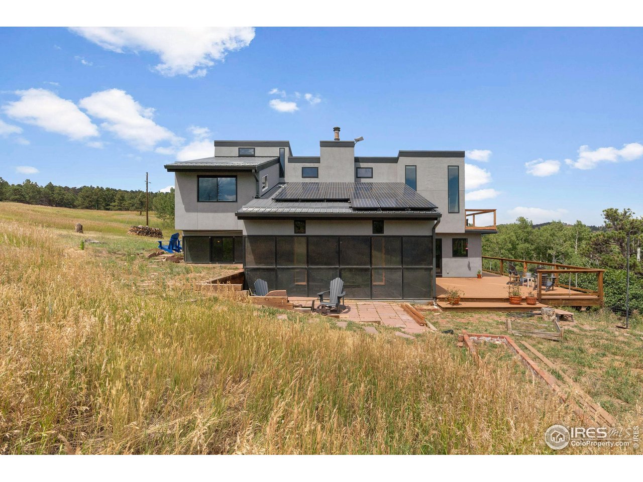 89 Gold Trail Boulder, CO 80302 - Photo 32 of 48 a view of a swimming pool with a patio