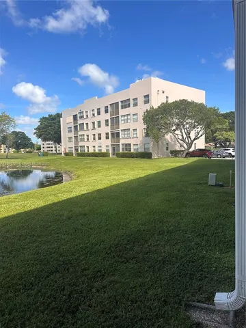a view of a large building with a big yard