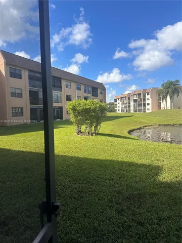 a view of a house with a big yard